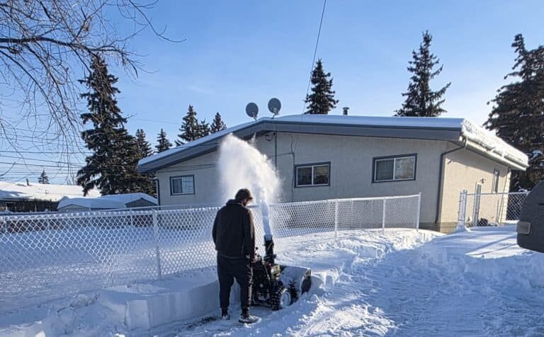 Clearing a Grande Prairie driveway with a snow blower